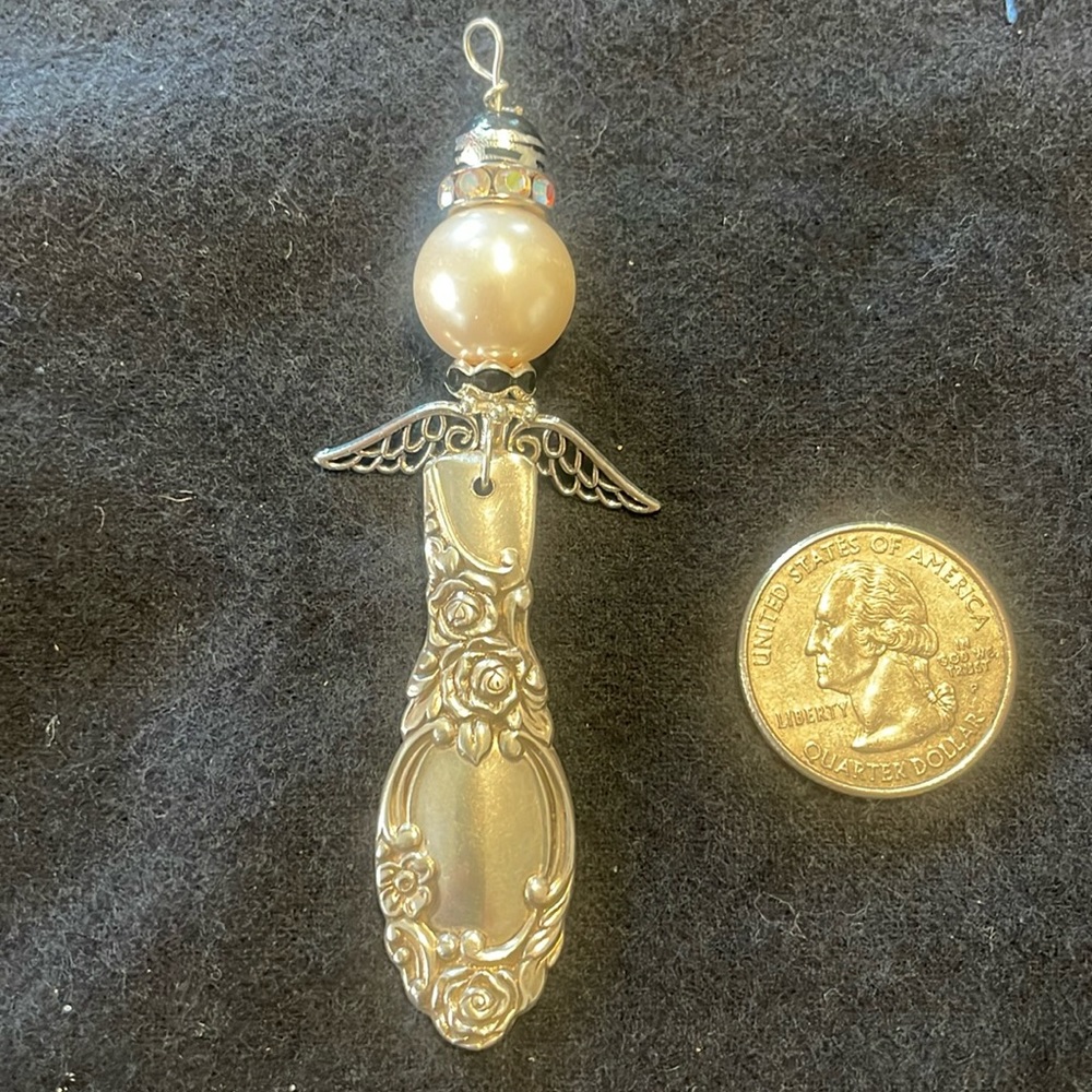 Handmade ornate silver angel pendant/ornament.